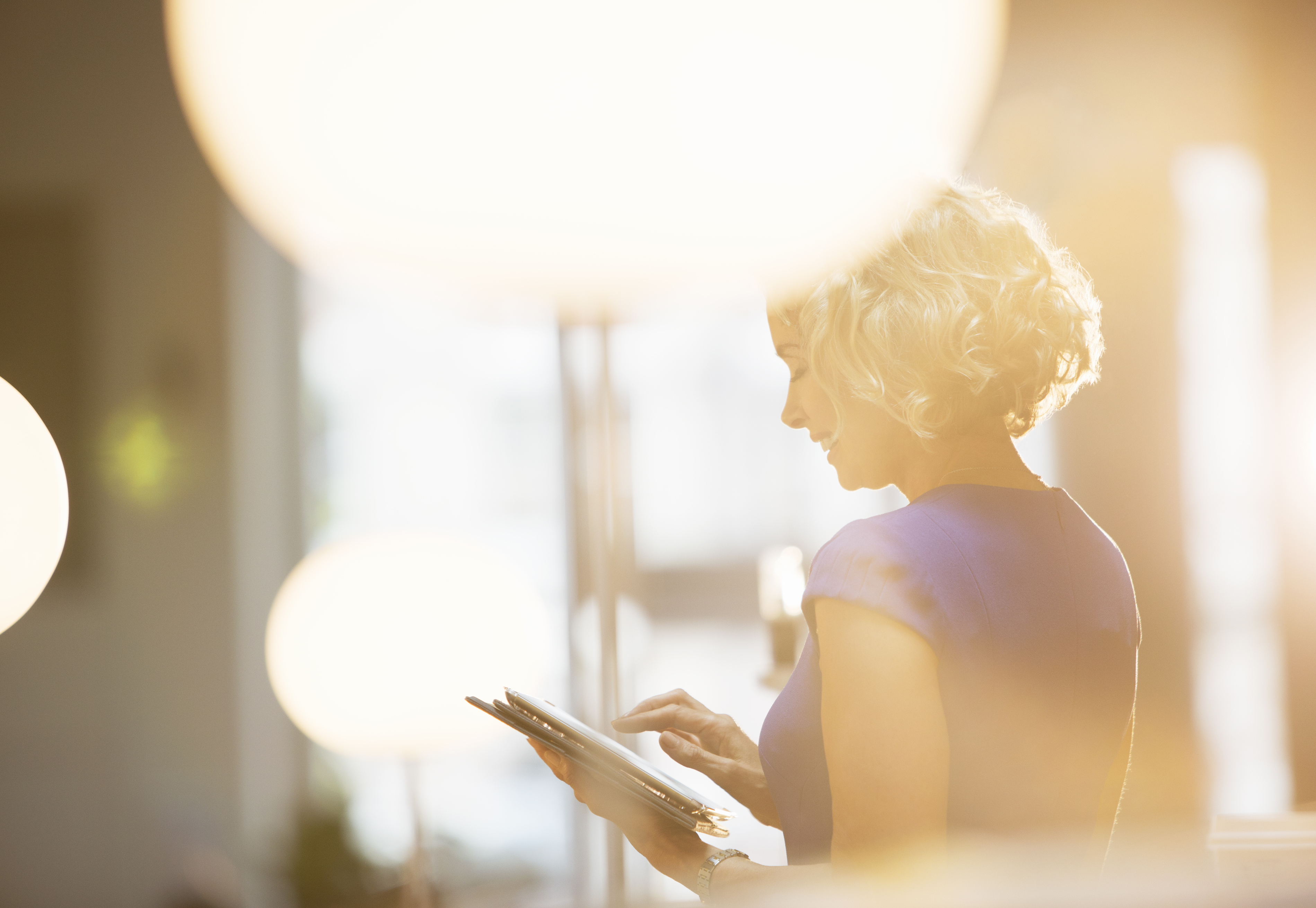 Woman reading at work in the sunshine